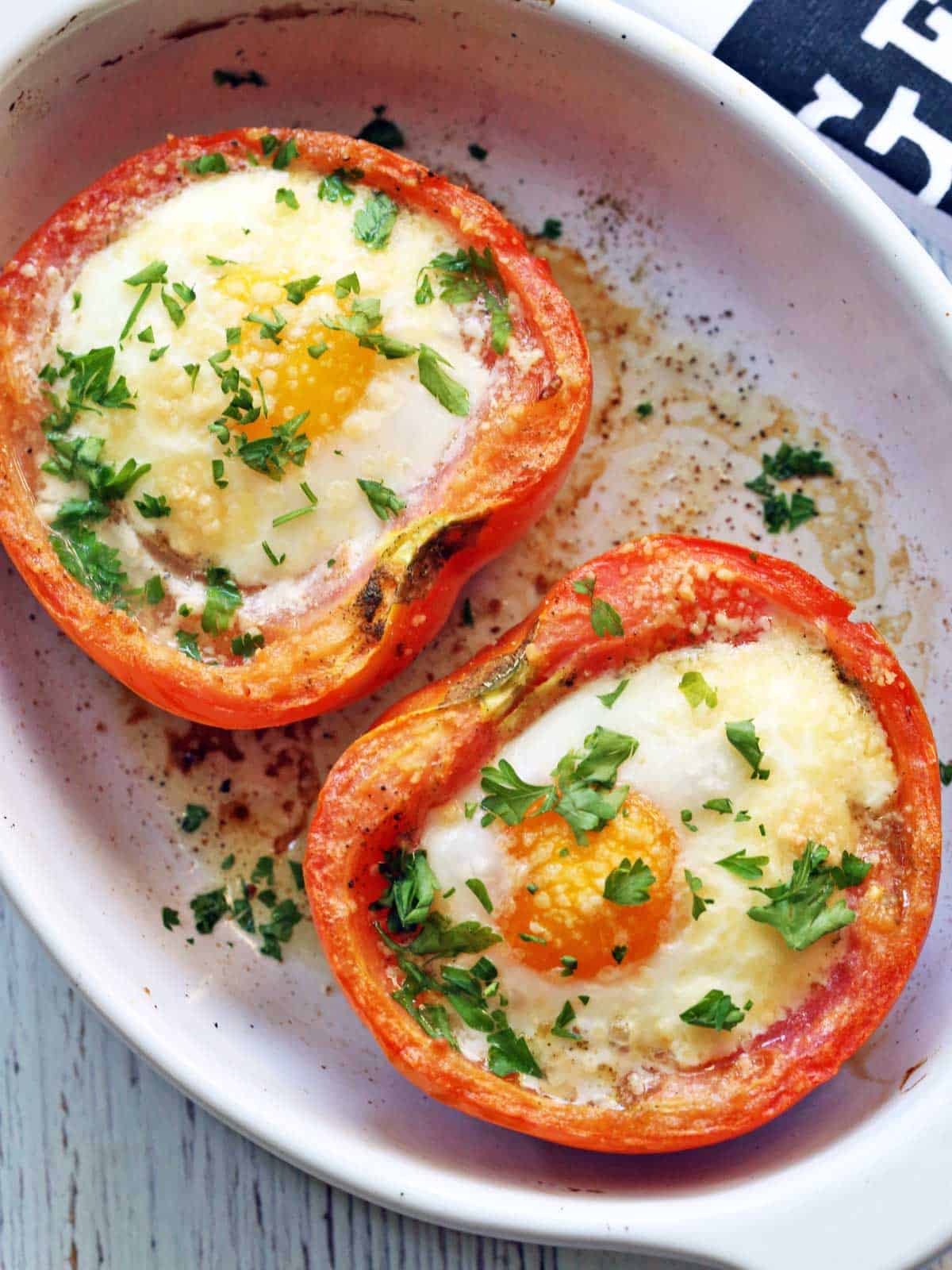 Breakfast tomatoes served in a white baking dish. 
