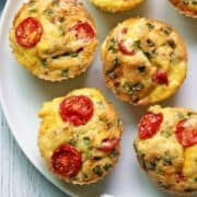 Egg muffins are served on a white plate.