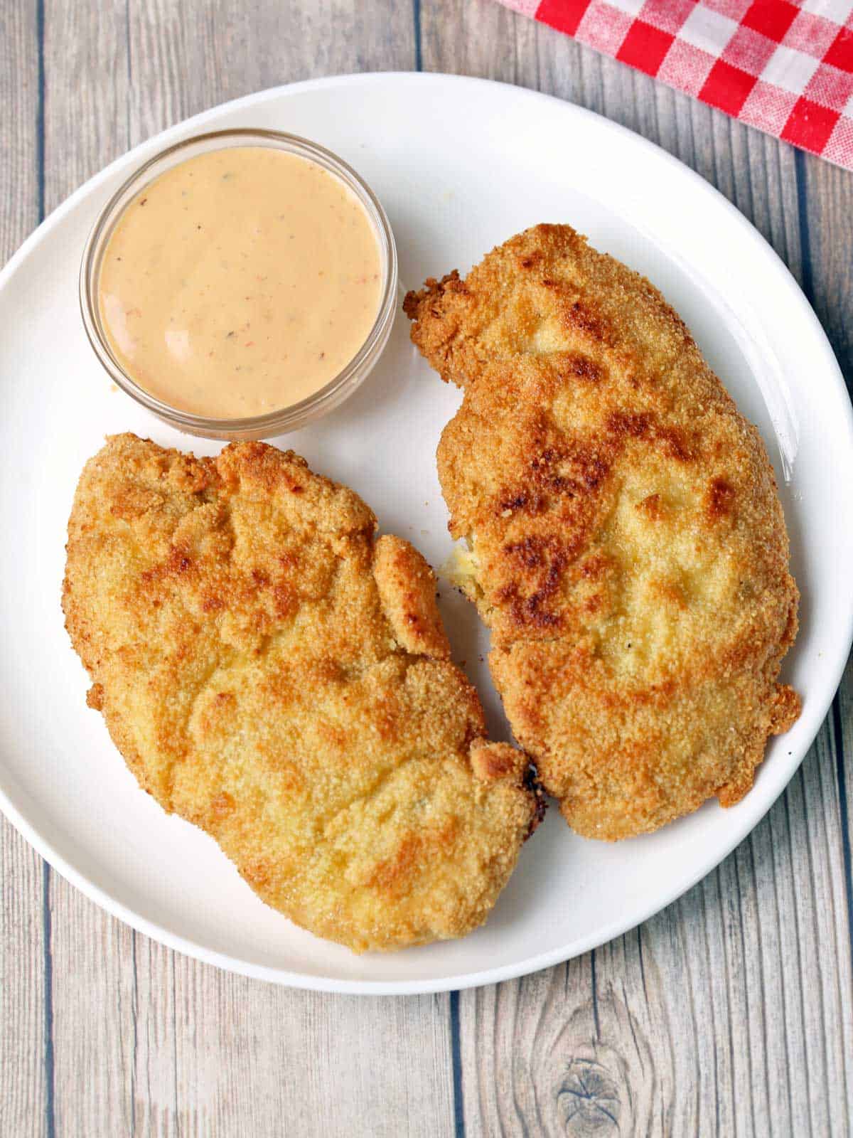 Gluten-free chicken tenders served with a dipping sauce. 