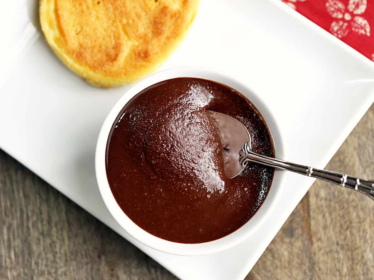 Keto hazelnut spread served in a bowl with a toasted keto English muffin. 