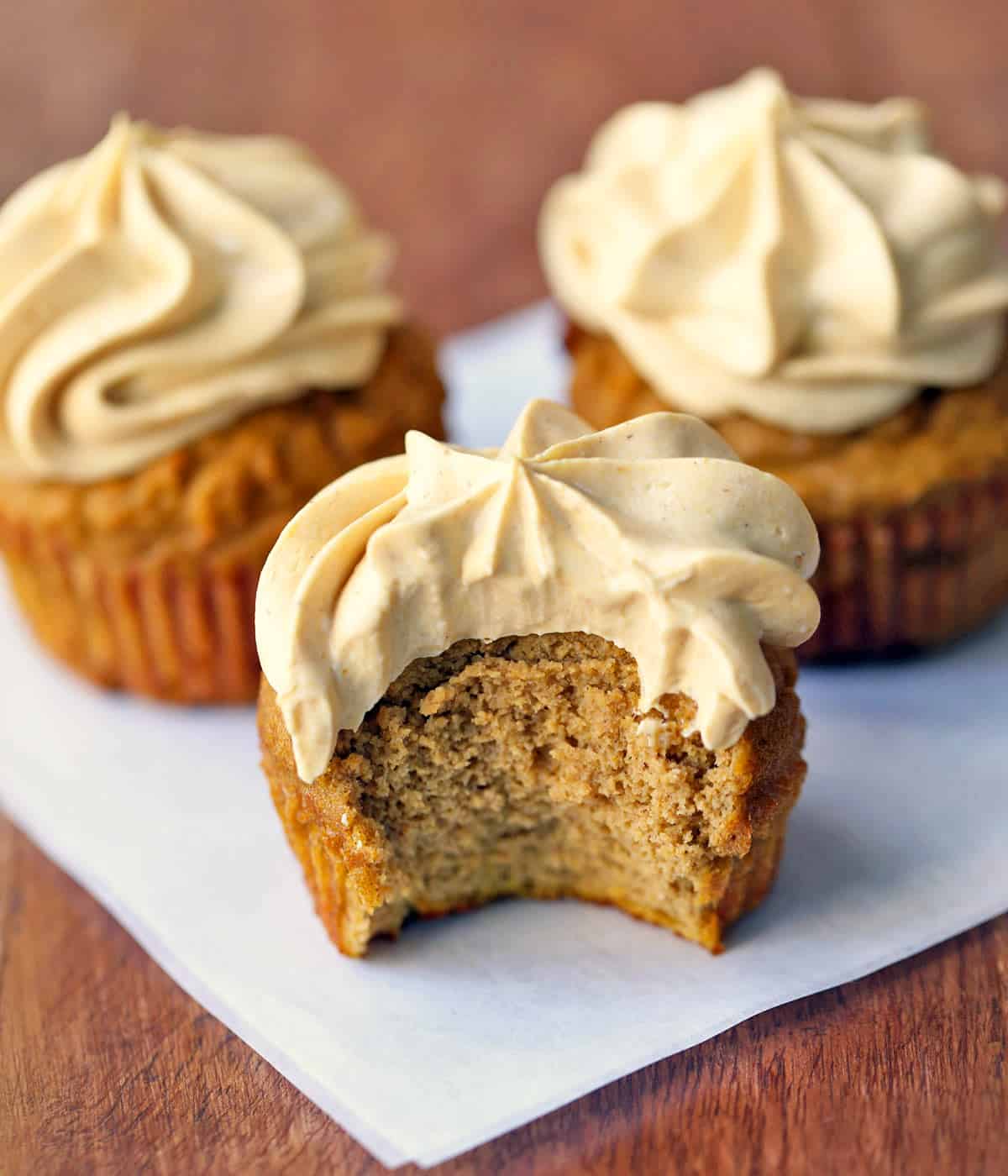 Low-carb pumpkin cupcakes topped with pumpkin-flavored frosting. 