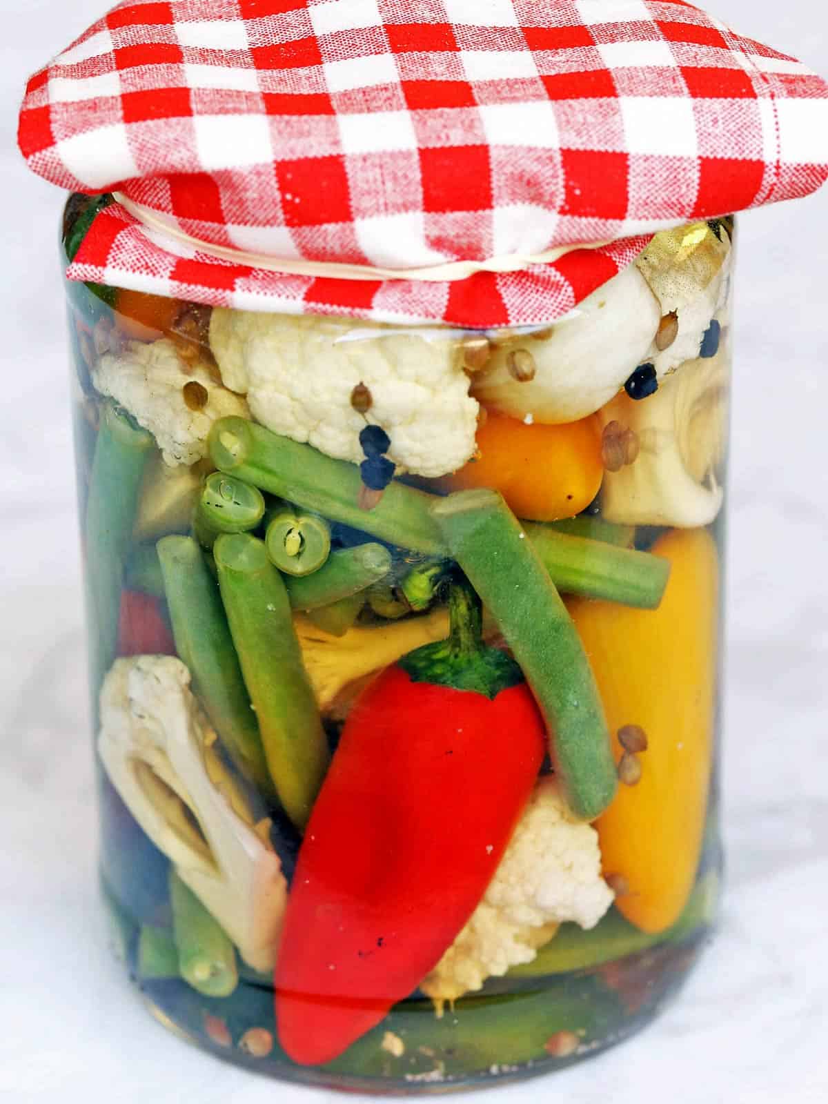 Quick pickles served in a glass jar. 