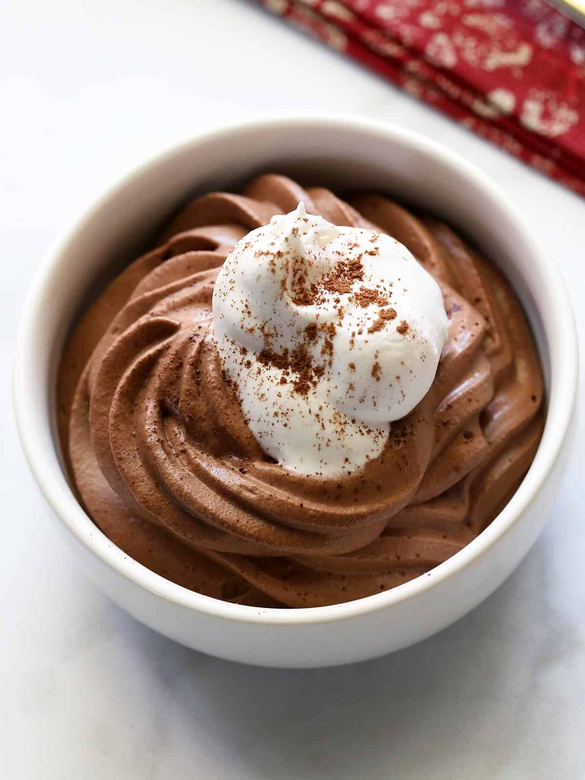 Keto chocolate mousse served in a white bowl. 