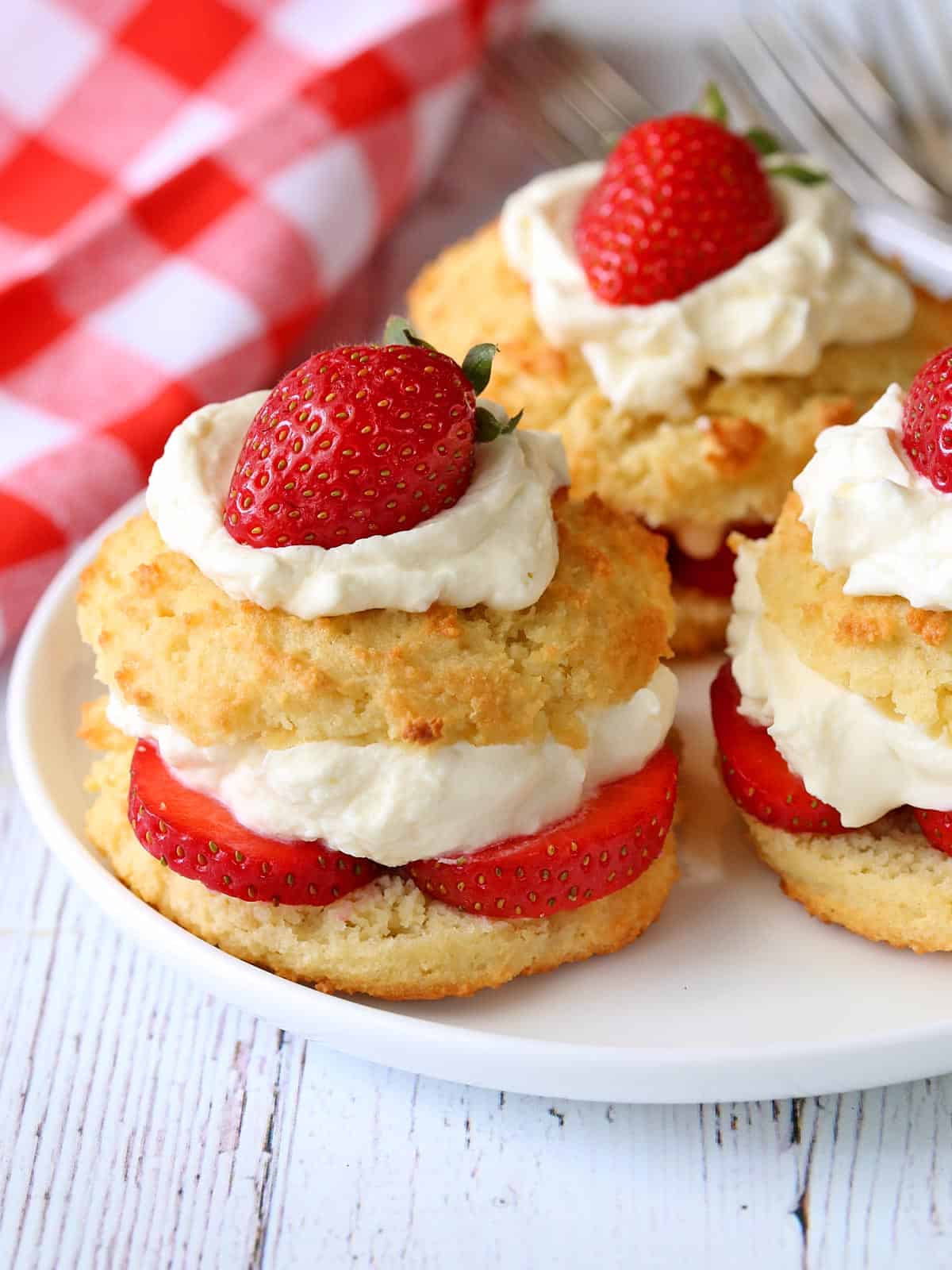 Keto strawberry shortcake served on a white plate. 