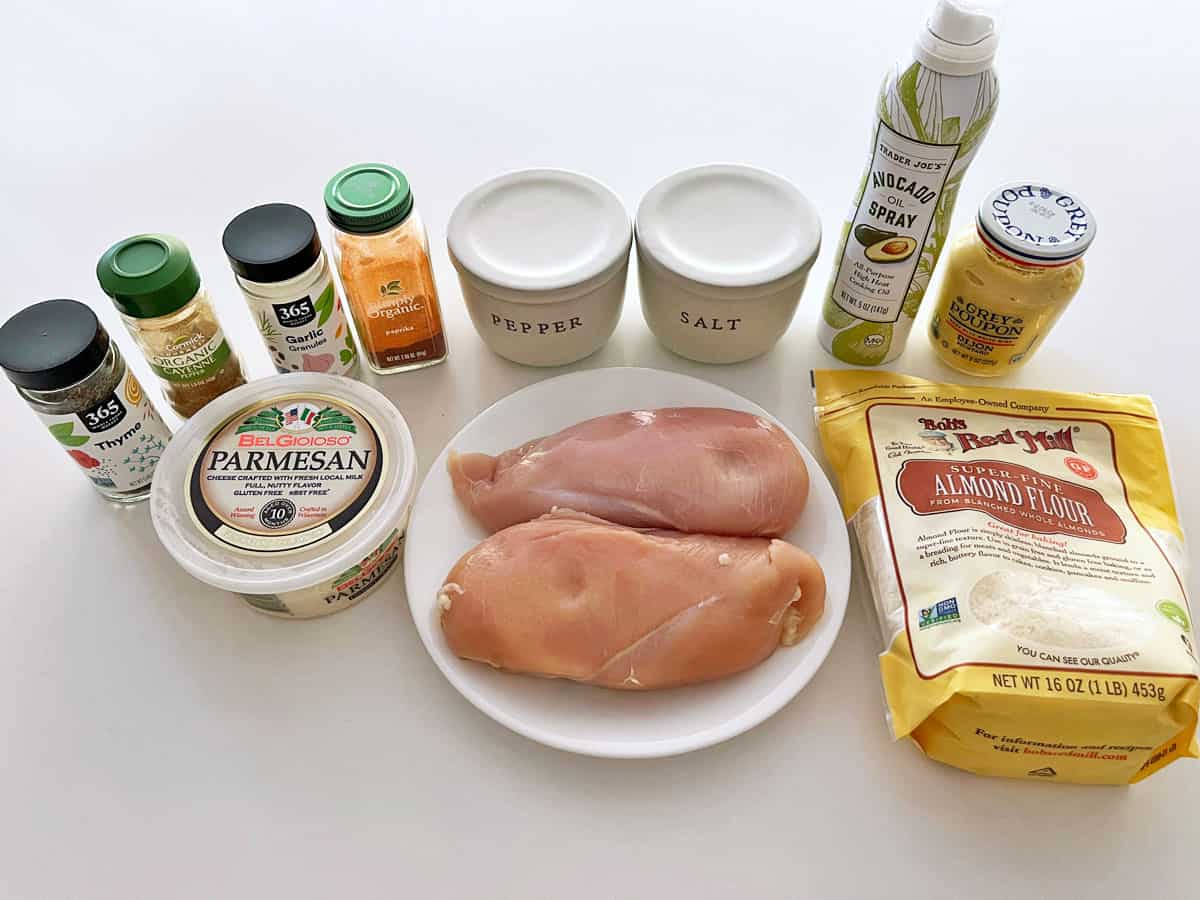 The ingredients needed to make parmesan-crusted chicken. 