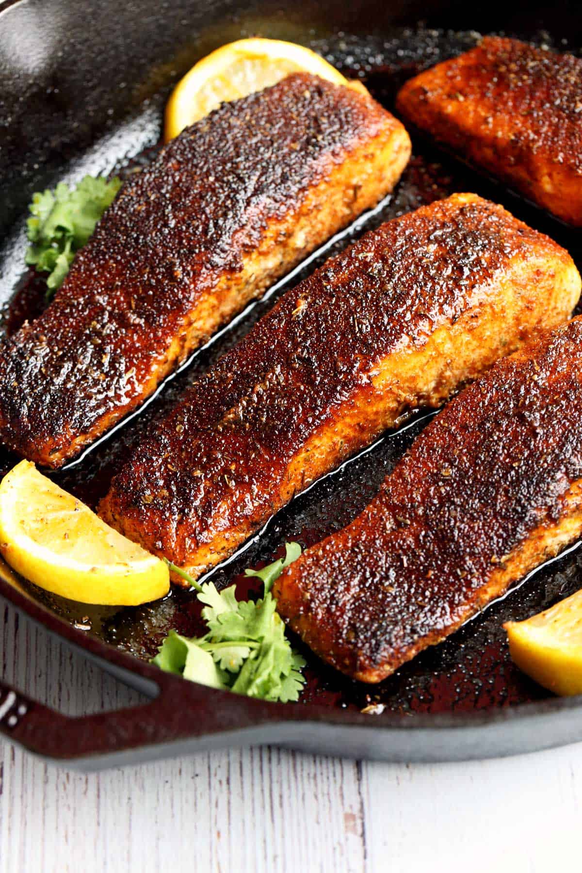 Blackened salmon served in a cast-iron skillet. 