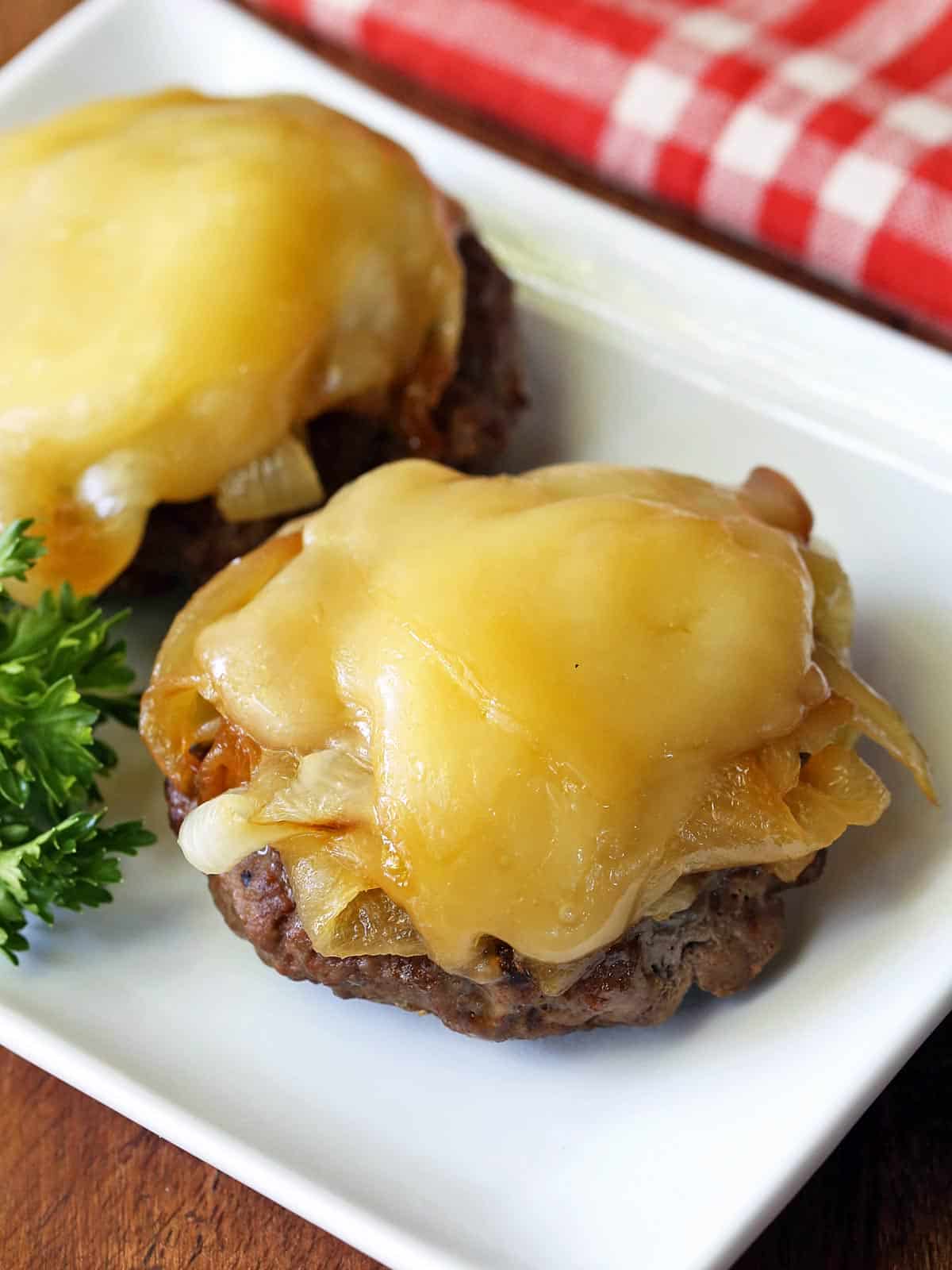 Broiled burgers topped with melted cheese. 
