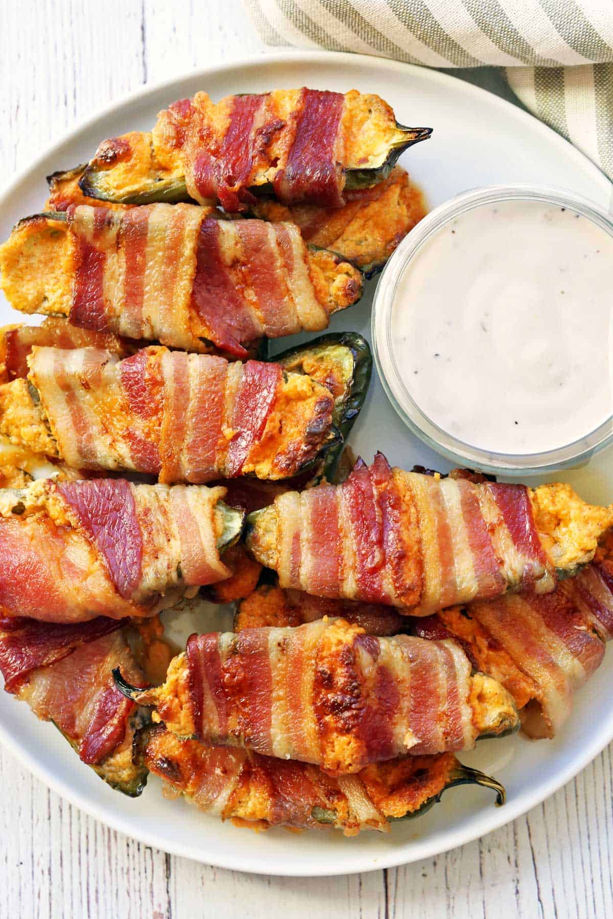 Jalapeno poppers served with a dip. 
