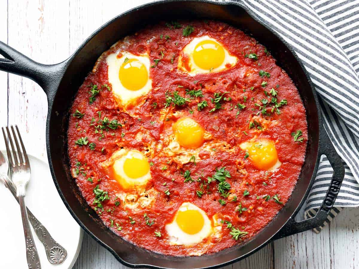 Shakshuka is served in a cast-iron skillet.