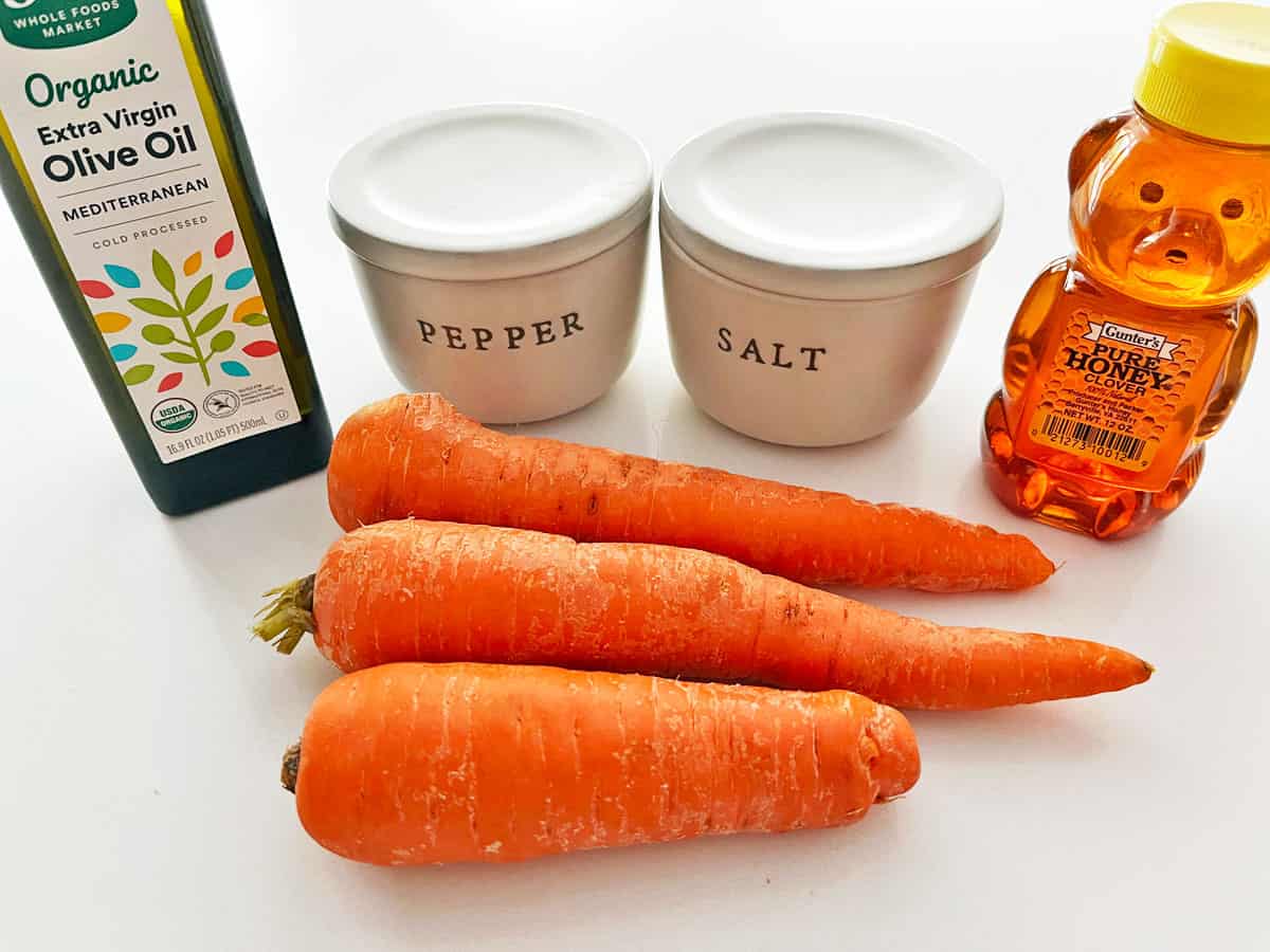 The ingredients needed to roast carrots in the oven. 