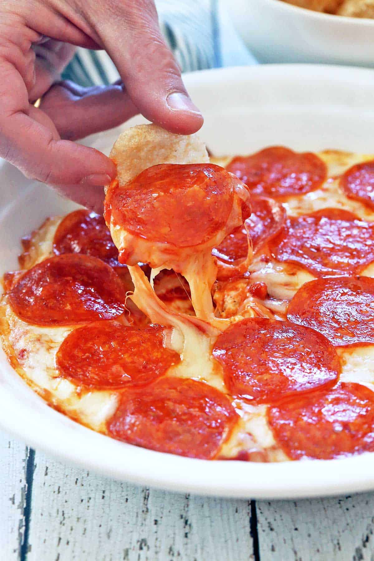 Pizza dip served in a white baking dish.