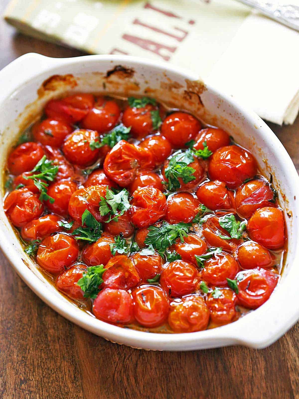 Roasted cherry tomatoes sprinkled with parsley for garnish.
