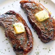 Picanha steak topped with butter.