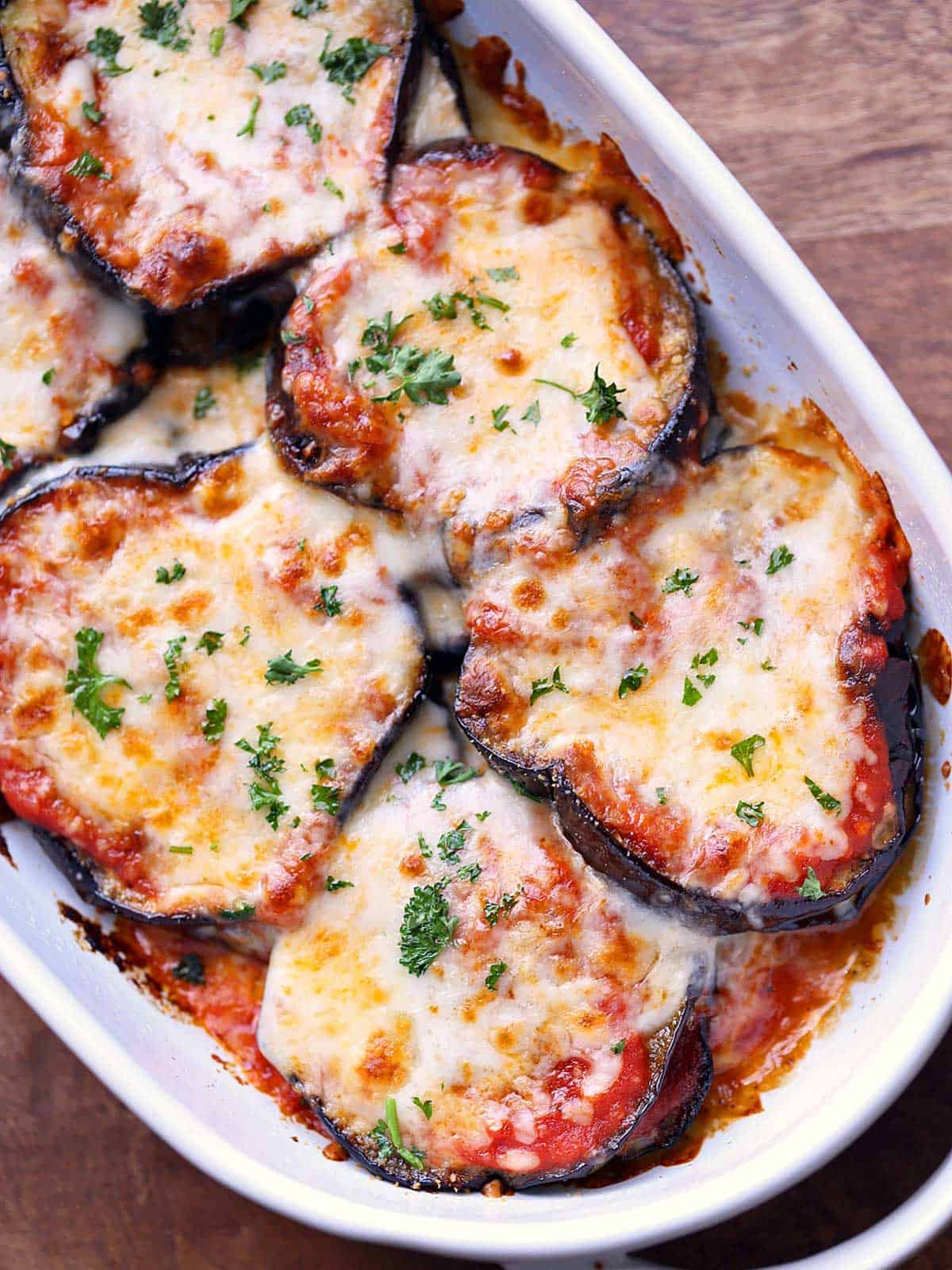 Eggplant casserole is served in a baking dish. 