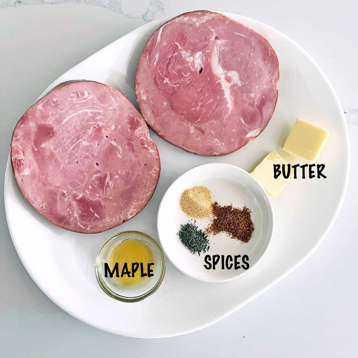 The ingredients needed to cook ham steaks. 