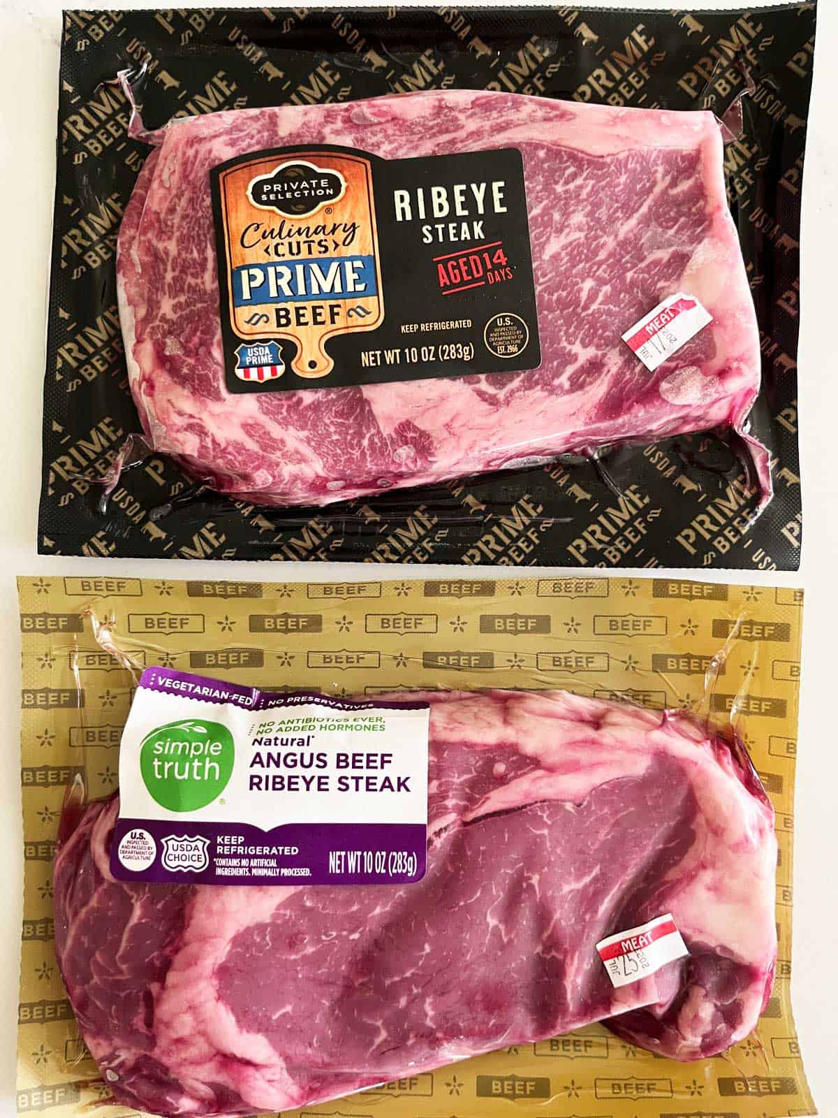 Prime and Choice ribeyes in their packages. 