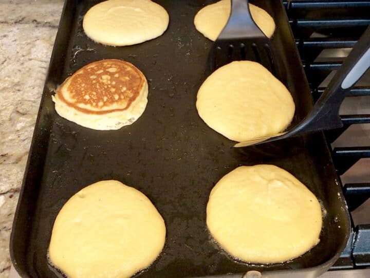 Cooking the pancakes on the griddle.
