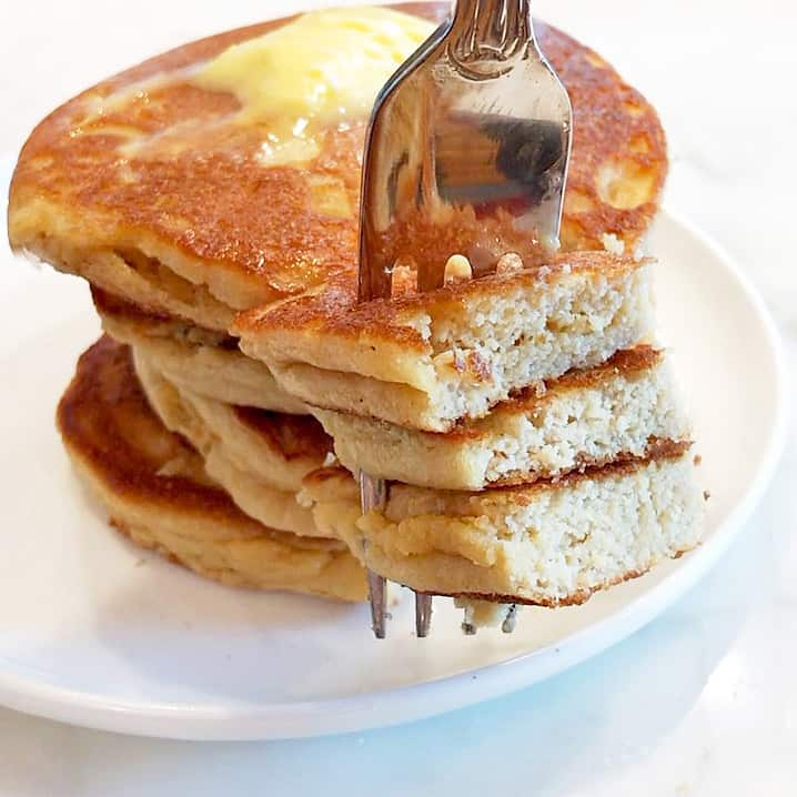 Serving almond flour pancakes topped with butter. 