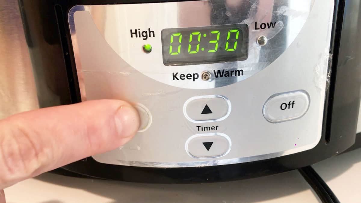 Setting the slow cooker to 30 minutes on HIGH. 