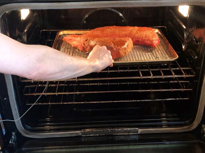 Placing the roast in the oven.