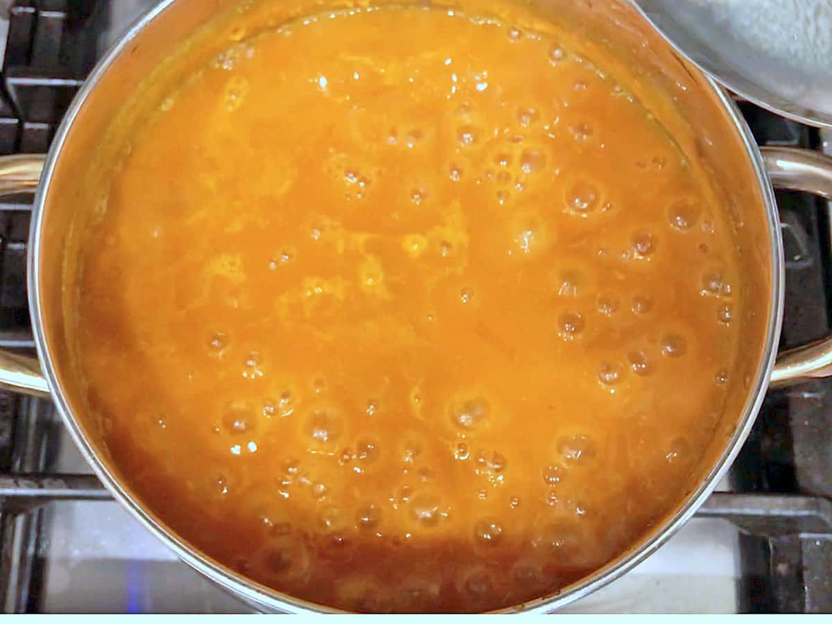Pumpkin curry soup boiling. 
