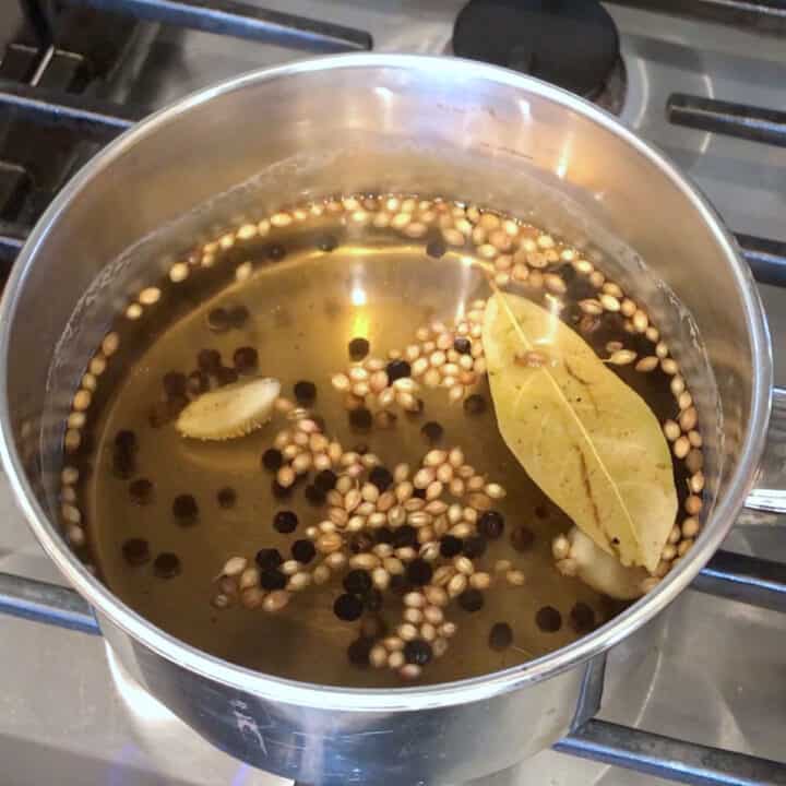 Preparing the brine for homemade pickles.