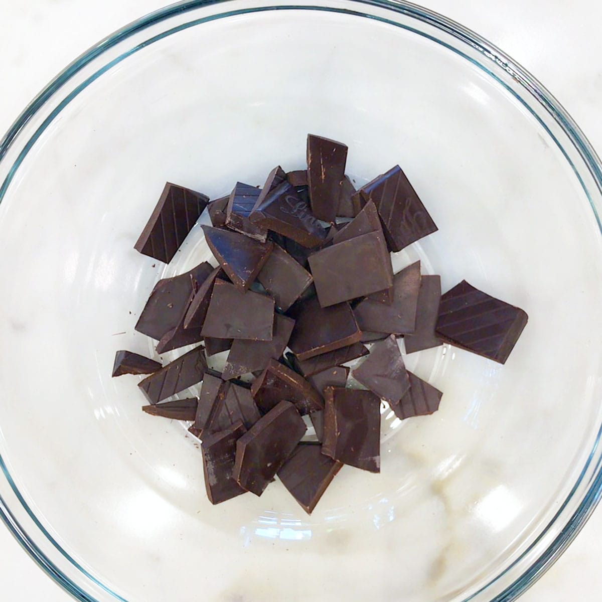 Dark chocolate pieces in a bowl. 