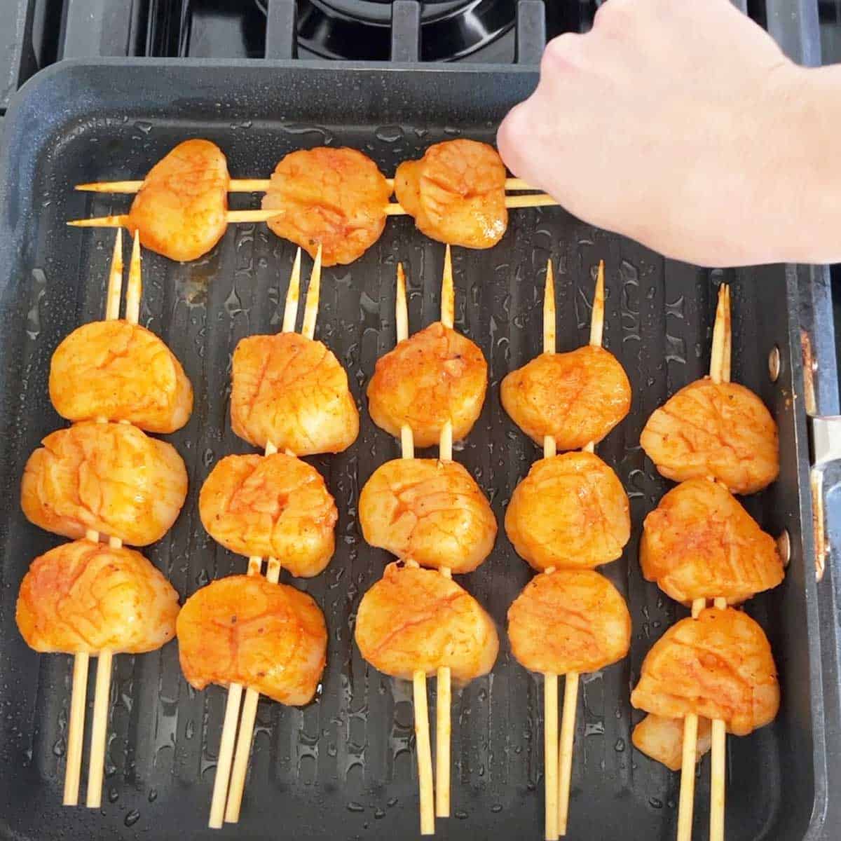 Grilling the scallops. 