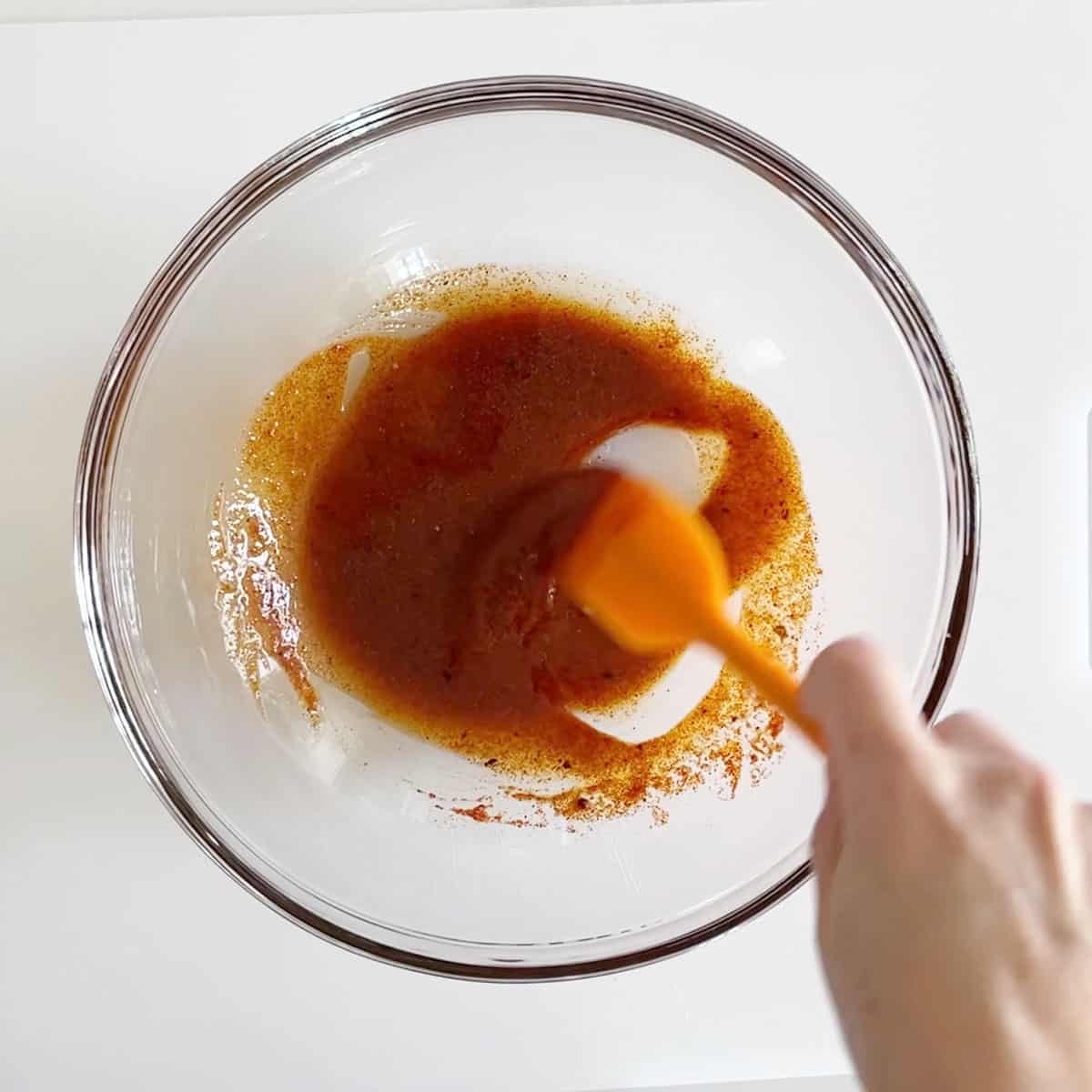 Mixing the marinade in a bowl. 