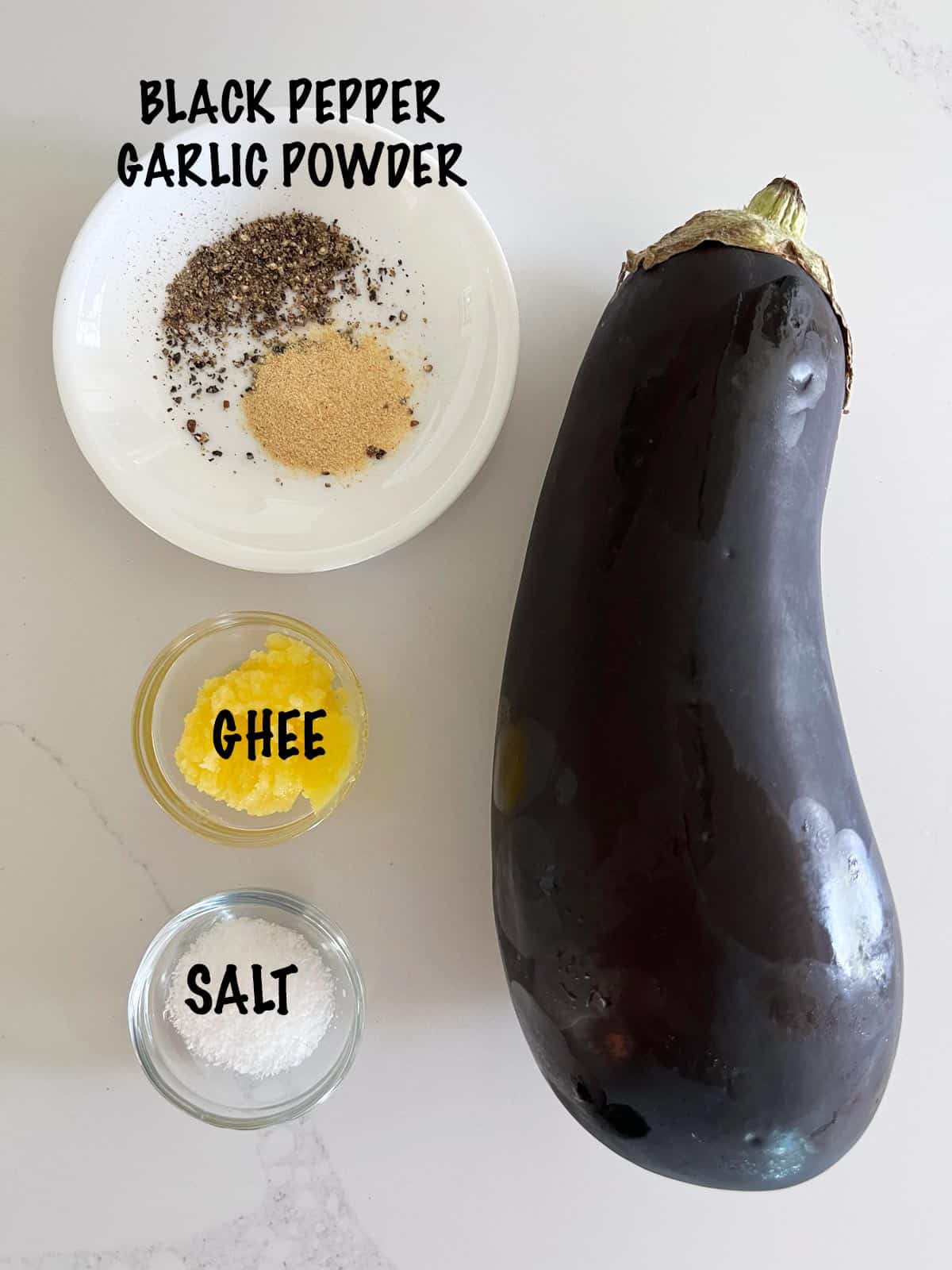 The ingredients needed to make roasted eggplant. 