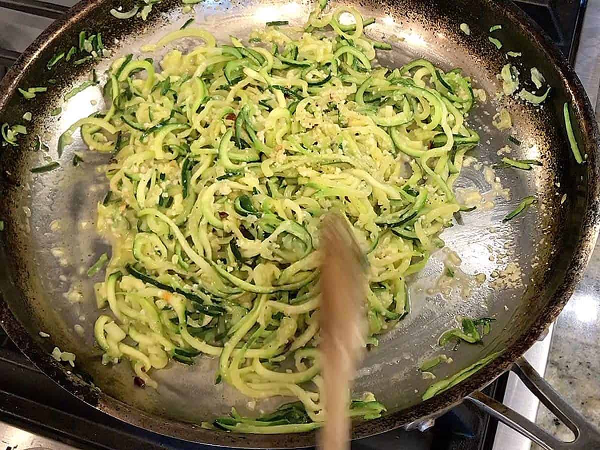 The zucchini noodles are ready in the skillet. 