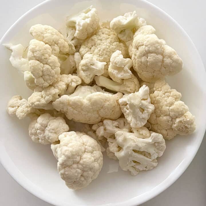 Cauliflower florets on a plate.