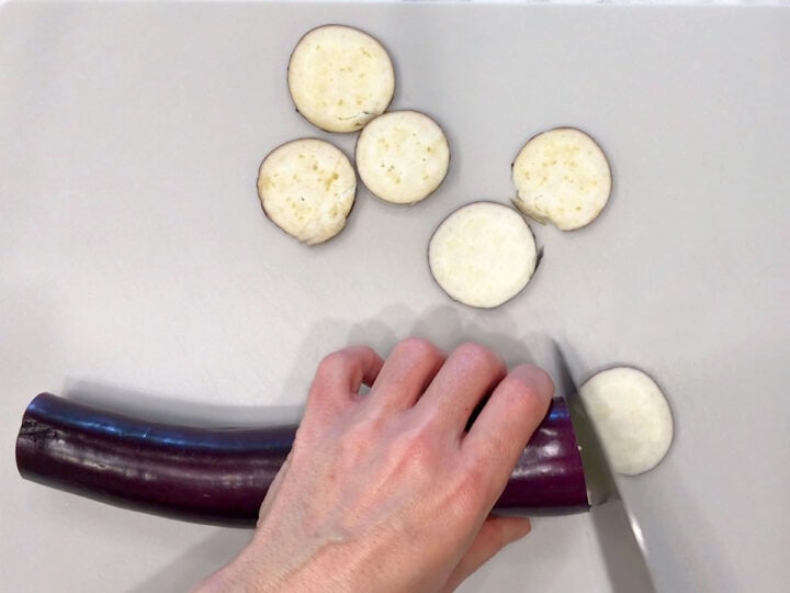 Slicing a Japanese eggplant.