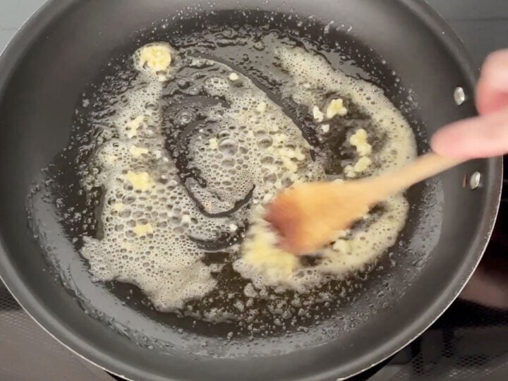 Cooking garlic in butter.