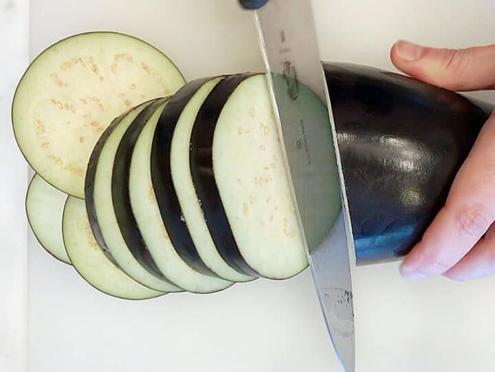 Slicing the eggplant.