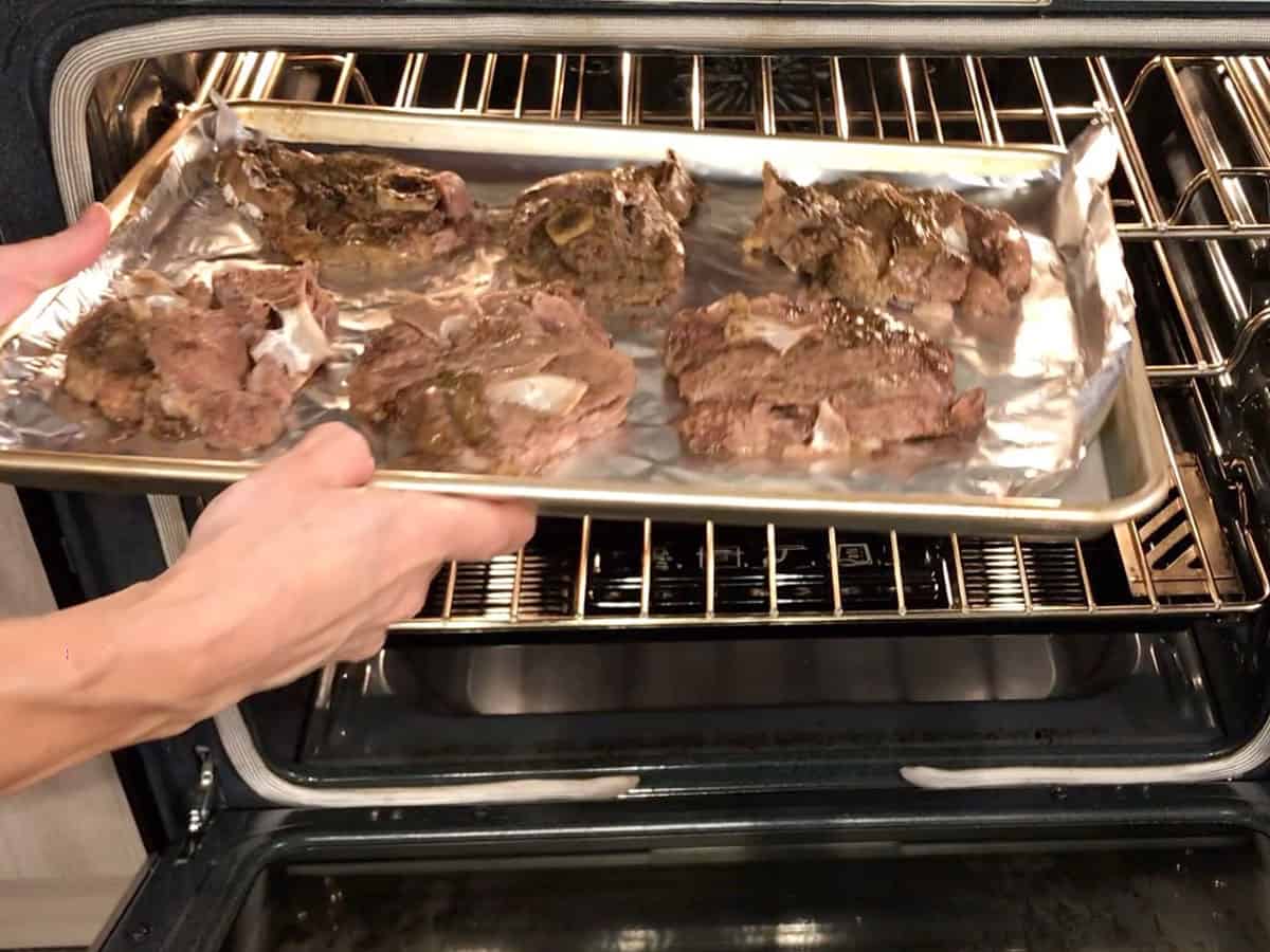Placing the chops under the broiler.