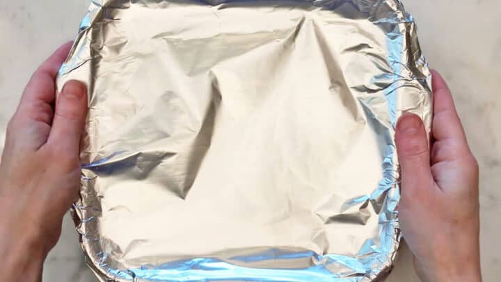 The baking dish is covered in foil.