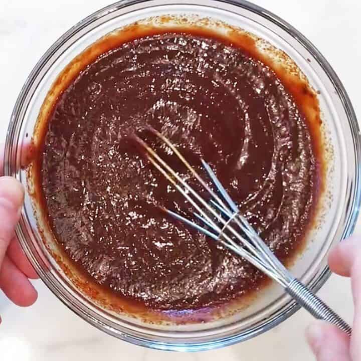 Mixing the BBQ sauce in a bowl.
