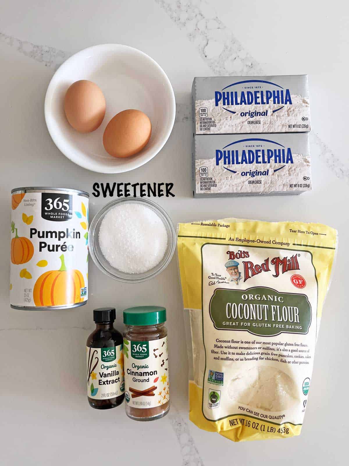 The ingredients needed to bake a keto pumpkin cheesecake.