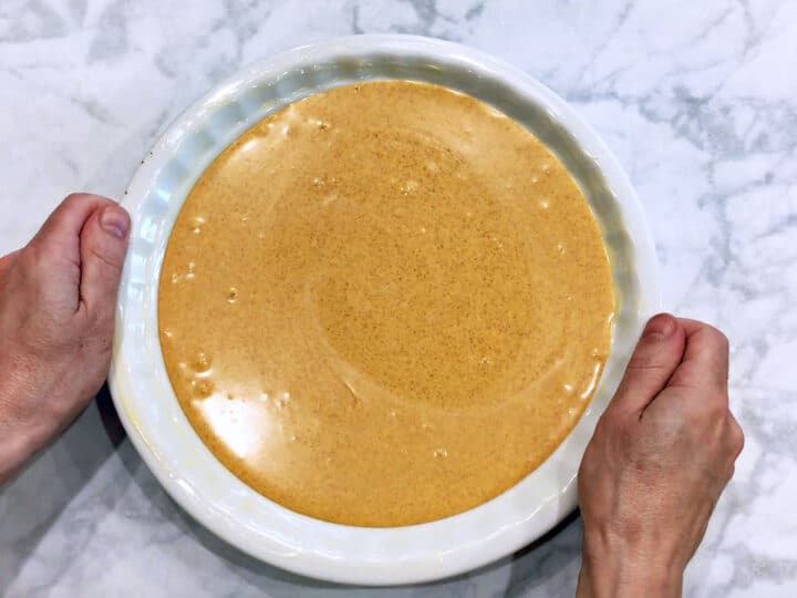 Keto pumpkin cheesecake batter in the pan.