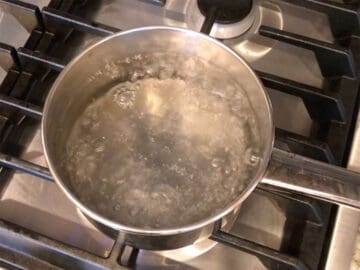 Boiling water in a small saucepan.