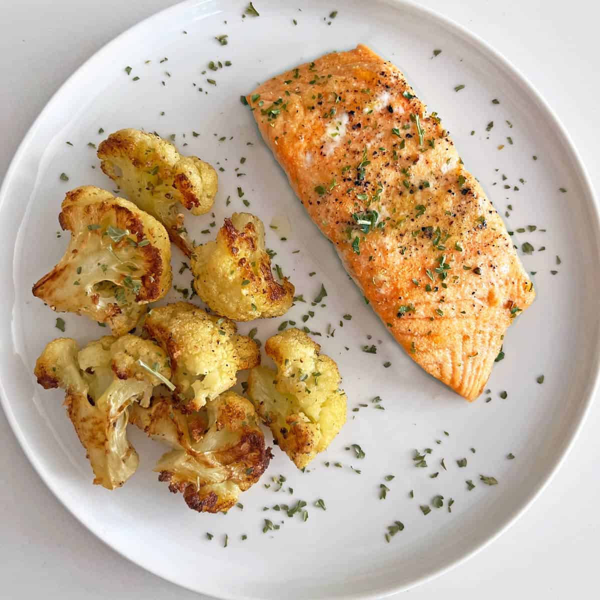 Baked salmon served with roasted cauliflower.