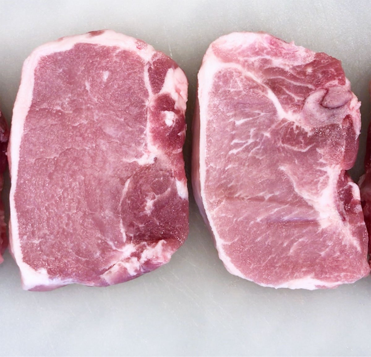 Raw boneless pork chops.