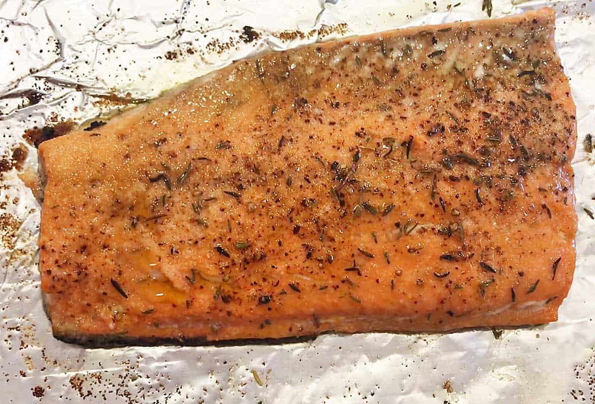 Broiled salmon is ready in the pan. 
