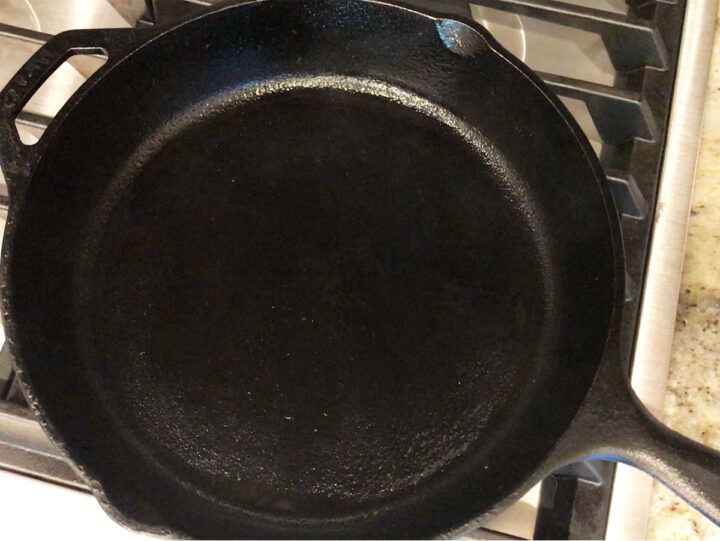 Heating a cast-iron skillet.