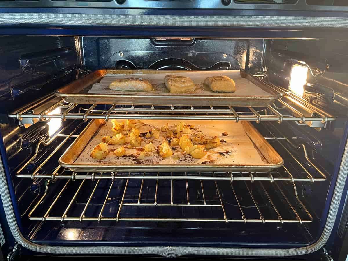 Baking cauliflower and salmon in the oven at the same time.