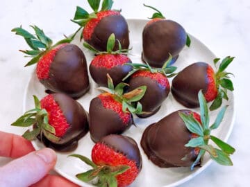 Chocolate covered strawberries are served.