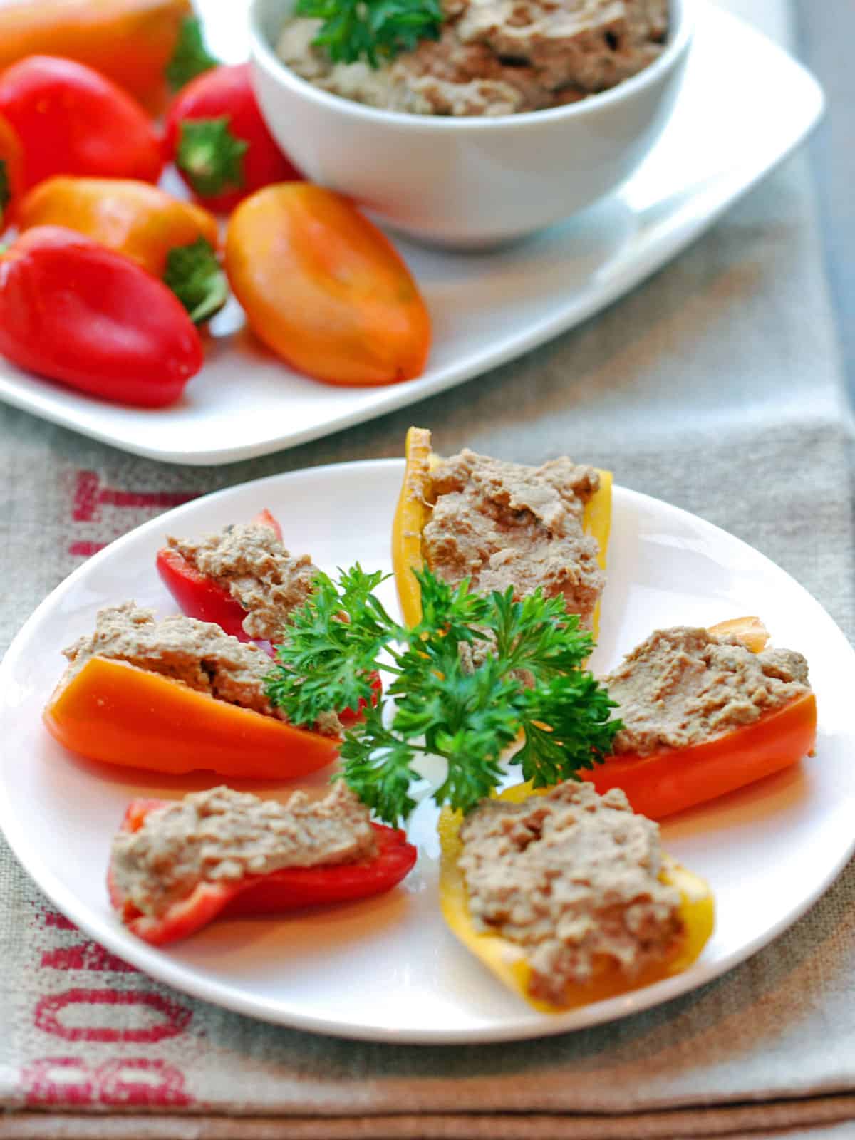 Chopped liver served with mini peppers.