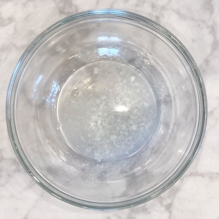 Melted coconut oil in a bowl.