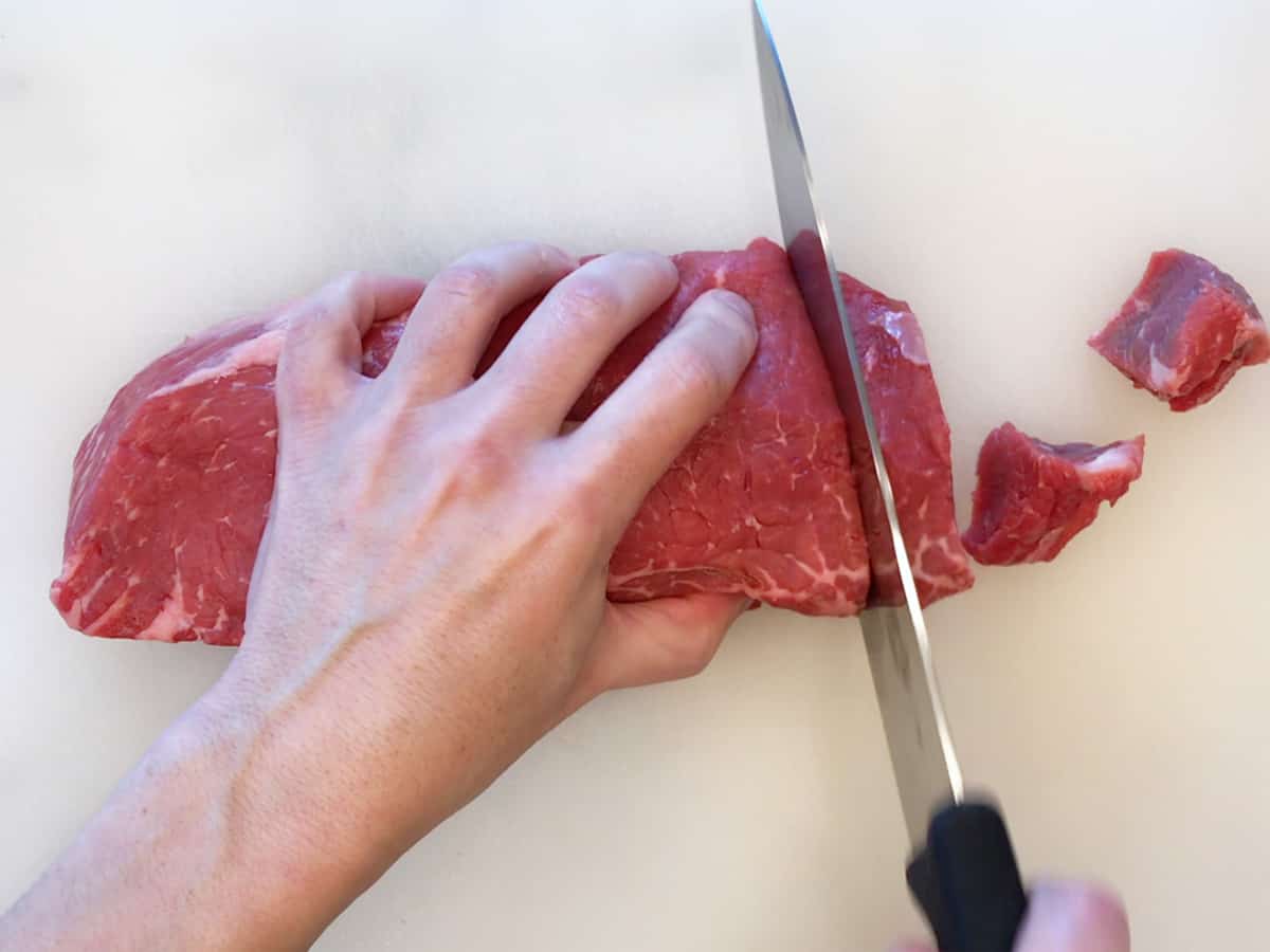 Cubing the steak.